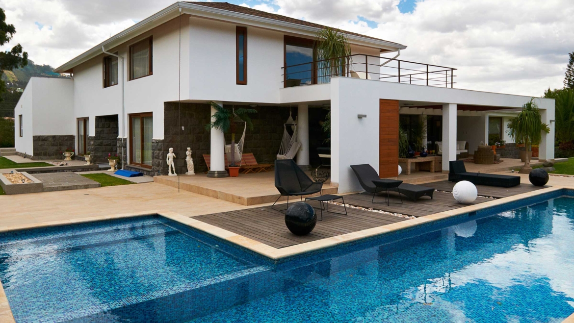 Geometric pool design using brick with gazebo & decorative lighting